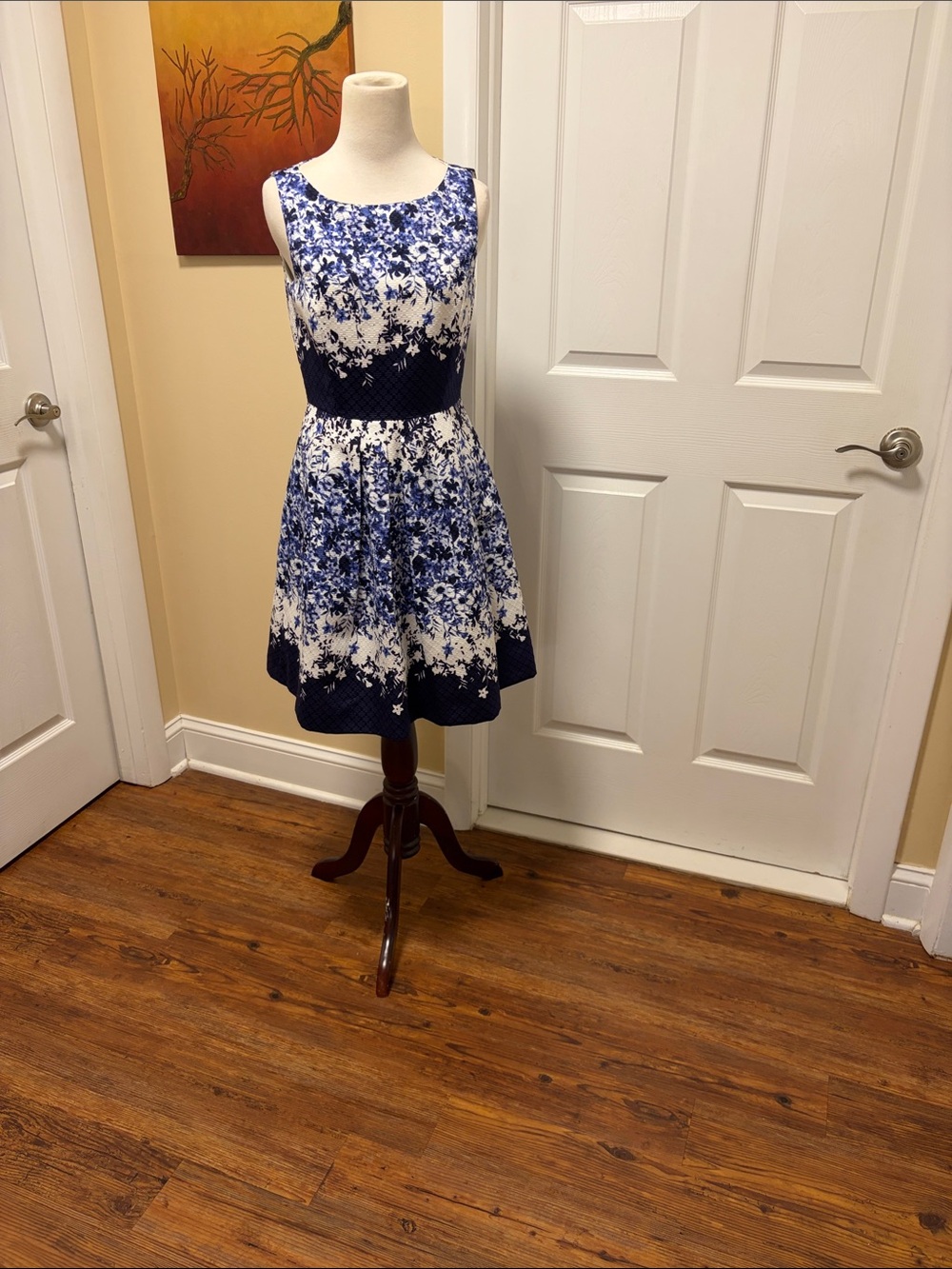 Sleeveless Blue and White Floral Midi Dress with Defined Waist
